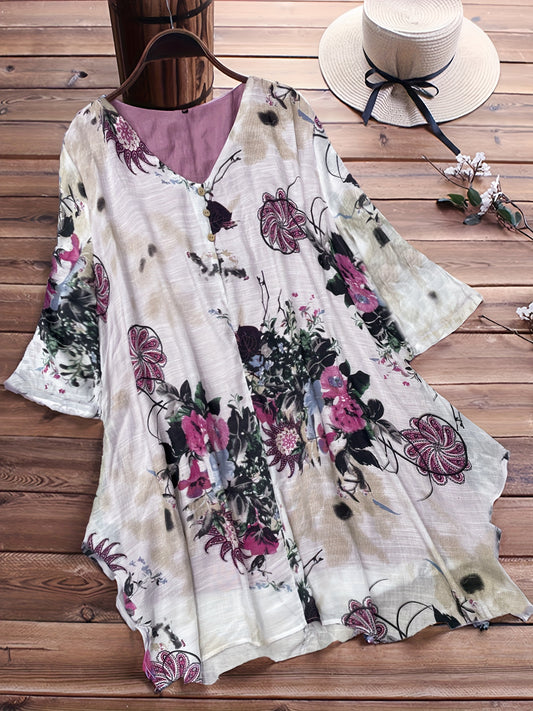 Women's plus size casual top with floral print, short sleeves, V-neck, and asymmetrical hem.