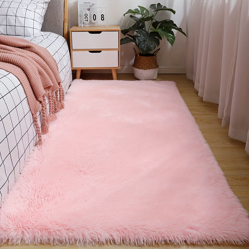 Soft and fluffy pink area rug, machine washable with a shaggy design. Perfect for adding a cozy touch to any living room, nursery, or dorm room. Non-slip and aesthetically pleasing.