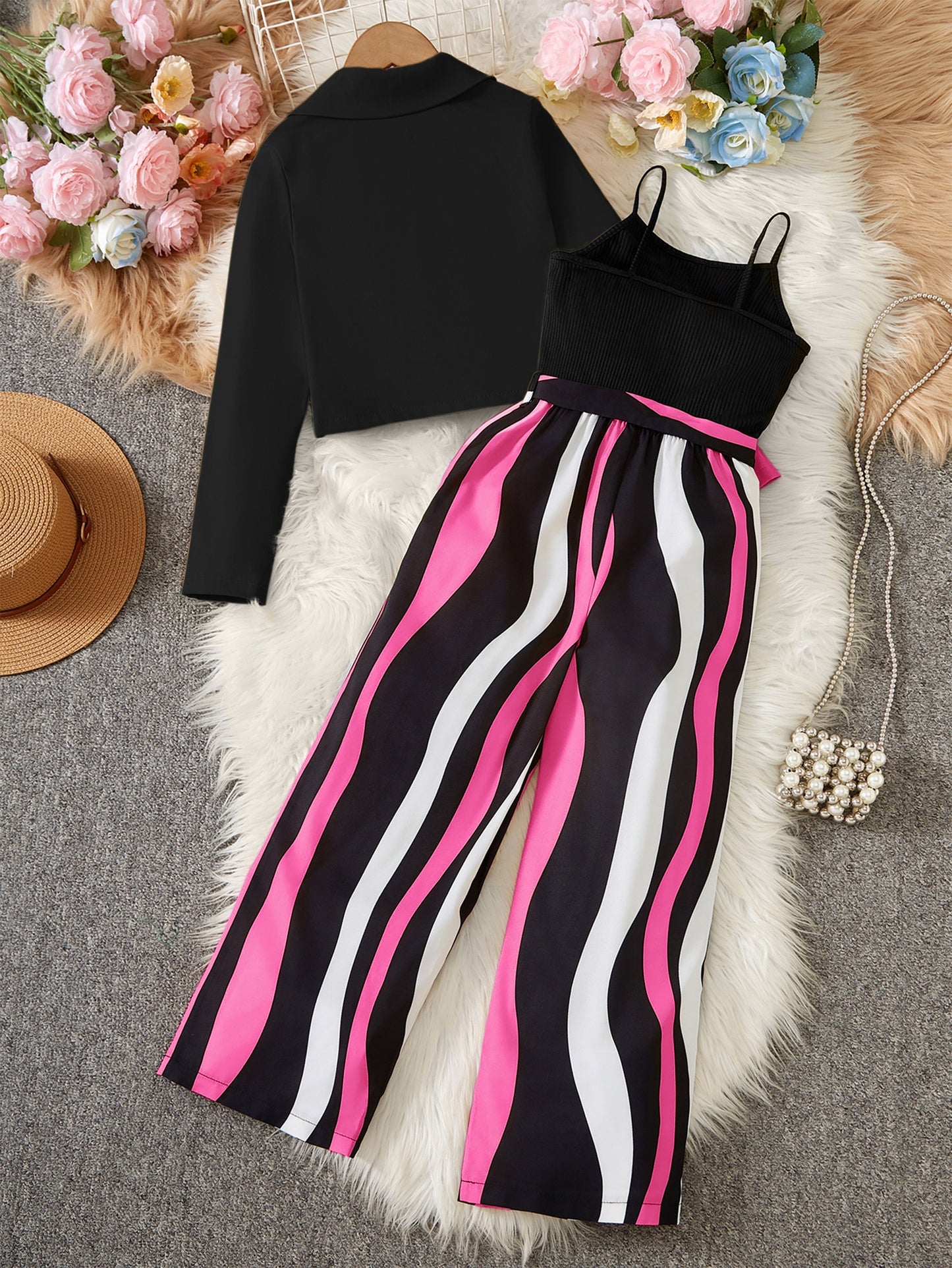 Girl's outfit includes a long sleeve short blazer, camisole, and striped jumpsuit set with belt. Stripe pattern is random. Perfect for outdoor wear.