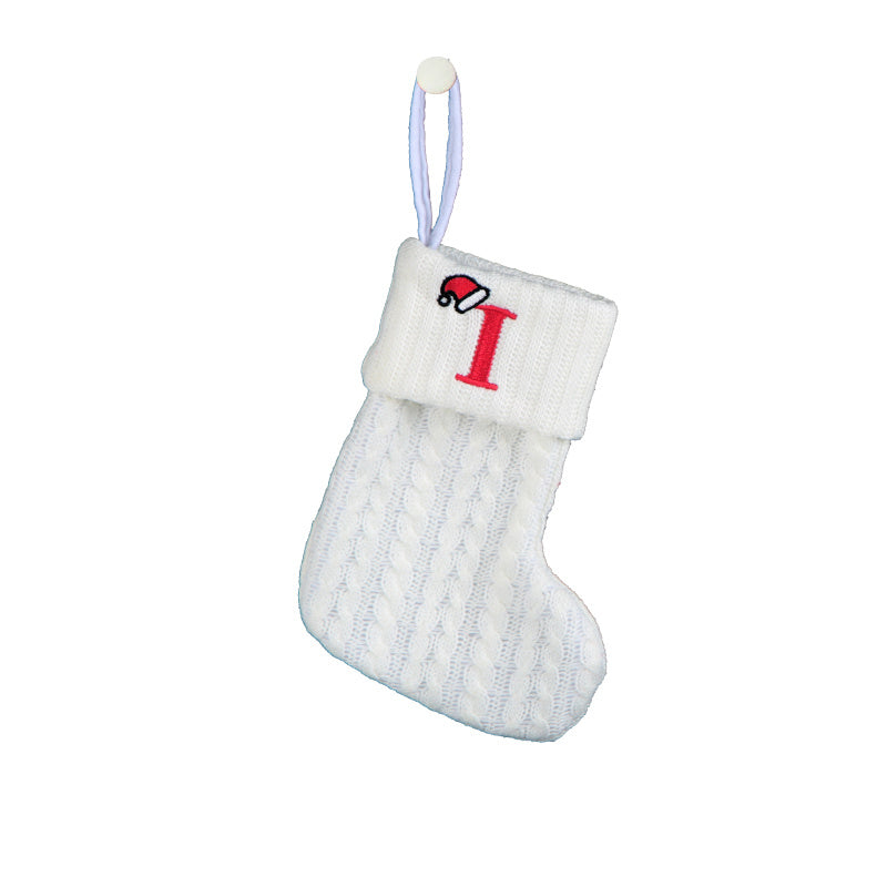 White cable knit stocking with embroidered 'F' - Ideal for indoor decor.