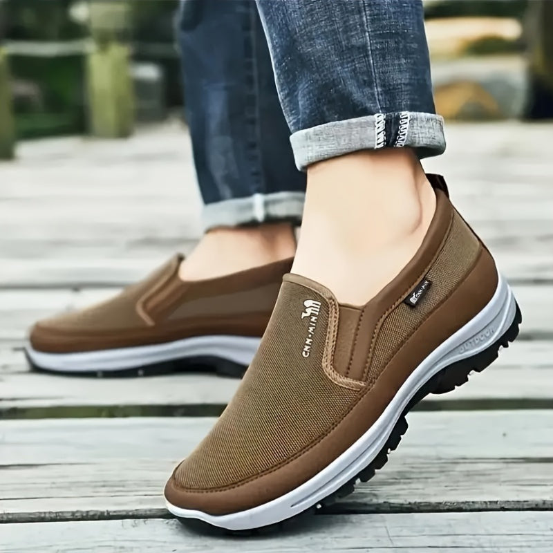 Comfortable men's slip-on sneakers with soft sole, breathable fabric, and stylish design for everyday wear.