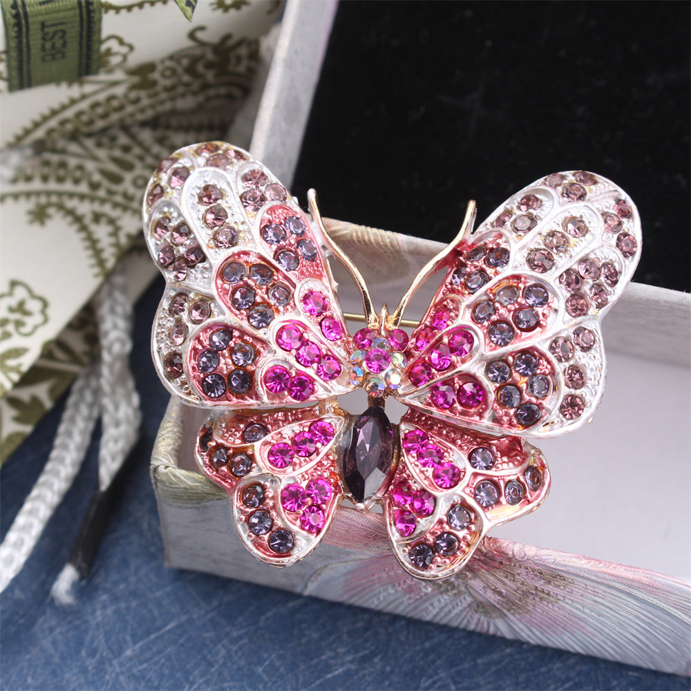 Stylish Rhinestone Butterfly Brooch Pin designed for Women, featuring a Luxurious and Unique Irregular Shape. This Fashion Accessory is perfect for adding a touch of elegance to any outfit. Ideal for Parties or as a special Gift for Couples, this inlaid