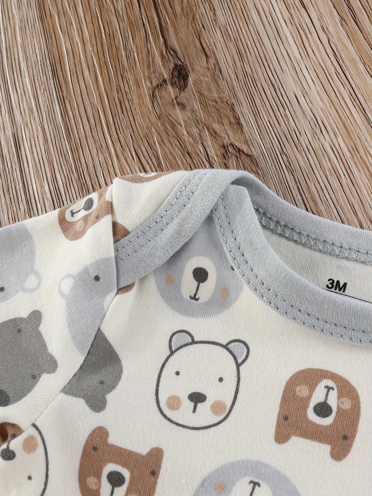 Baby boy's short sleeved cotton jumpsuit featuring plain color, stripes, bear embroidery, and bear heads print. Soft, breathable, and perfect for summer daily and outdoor wear.