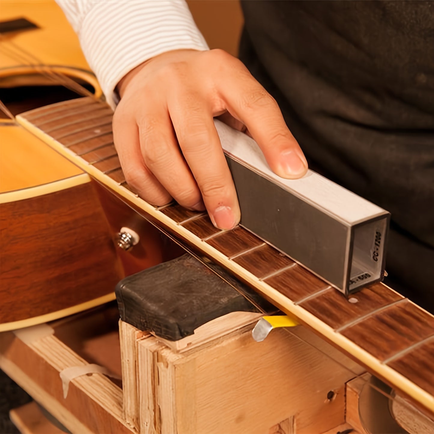 Guitar fingerboard luthier set with tools for fret leveling, crowning, fingerboard guards, and sanding papers.