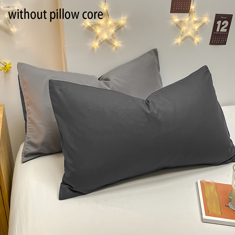 Basic set of 2 rectangular pillowcases made of 90g solid color fleece material, featuring an envelope closure design. These pillowcases are ultra soft, breathable, and machine washable, suitable for use in bedrooms, guest rooms, hotels, and more. The