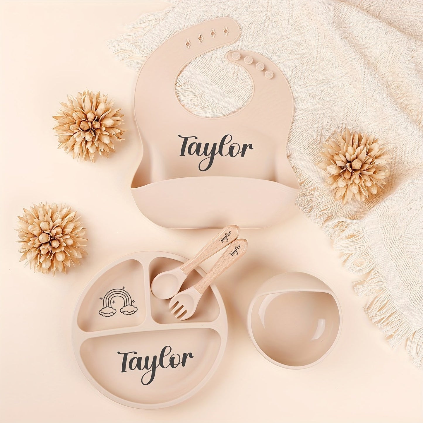 Personalize your child's mealtimes with our Customizable Feeding Set! This set includes a silicone weaning plate with your child's name and a fun cartoon design, along with a spoon, fork, and bowl. It makes the perfect shower gift for new parents.