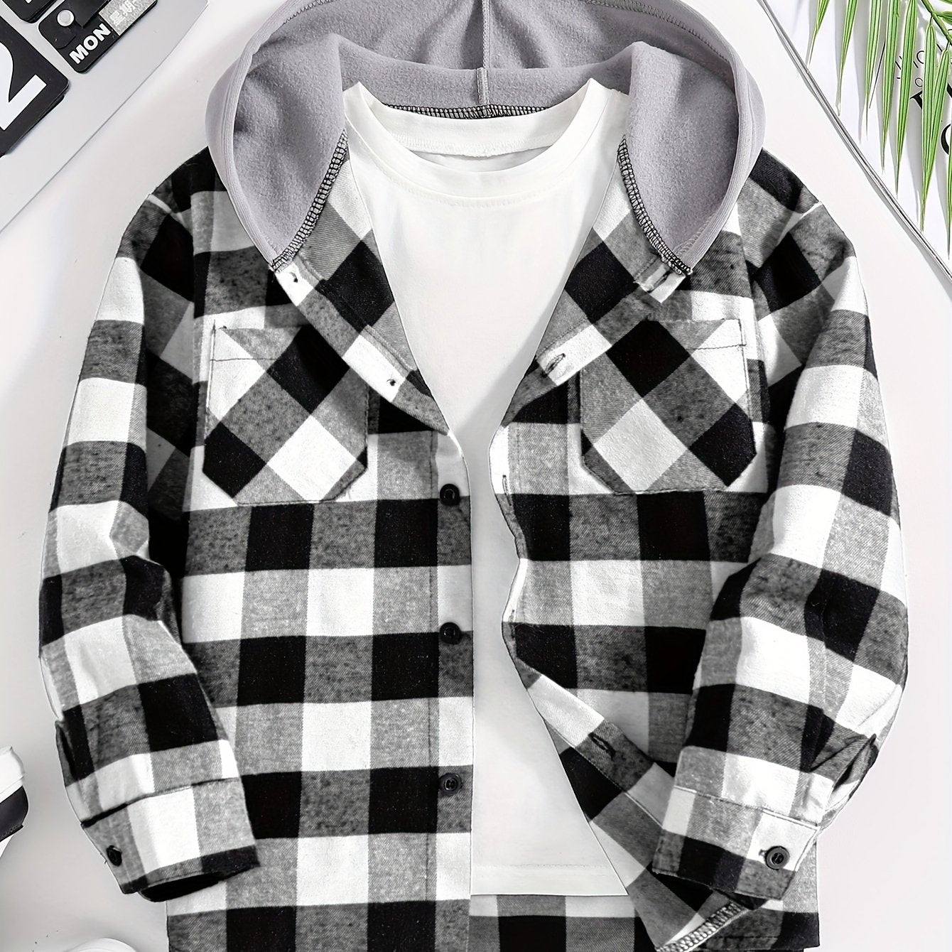 Boys' plaid hooded shirt in blue and black with flap pockets, made of cozy polyester for fall/winter casual wear.