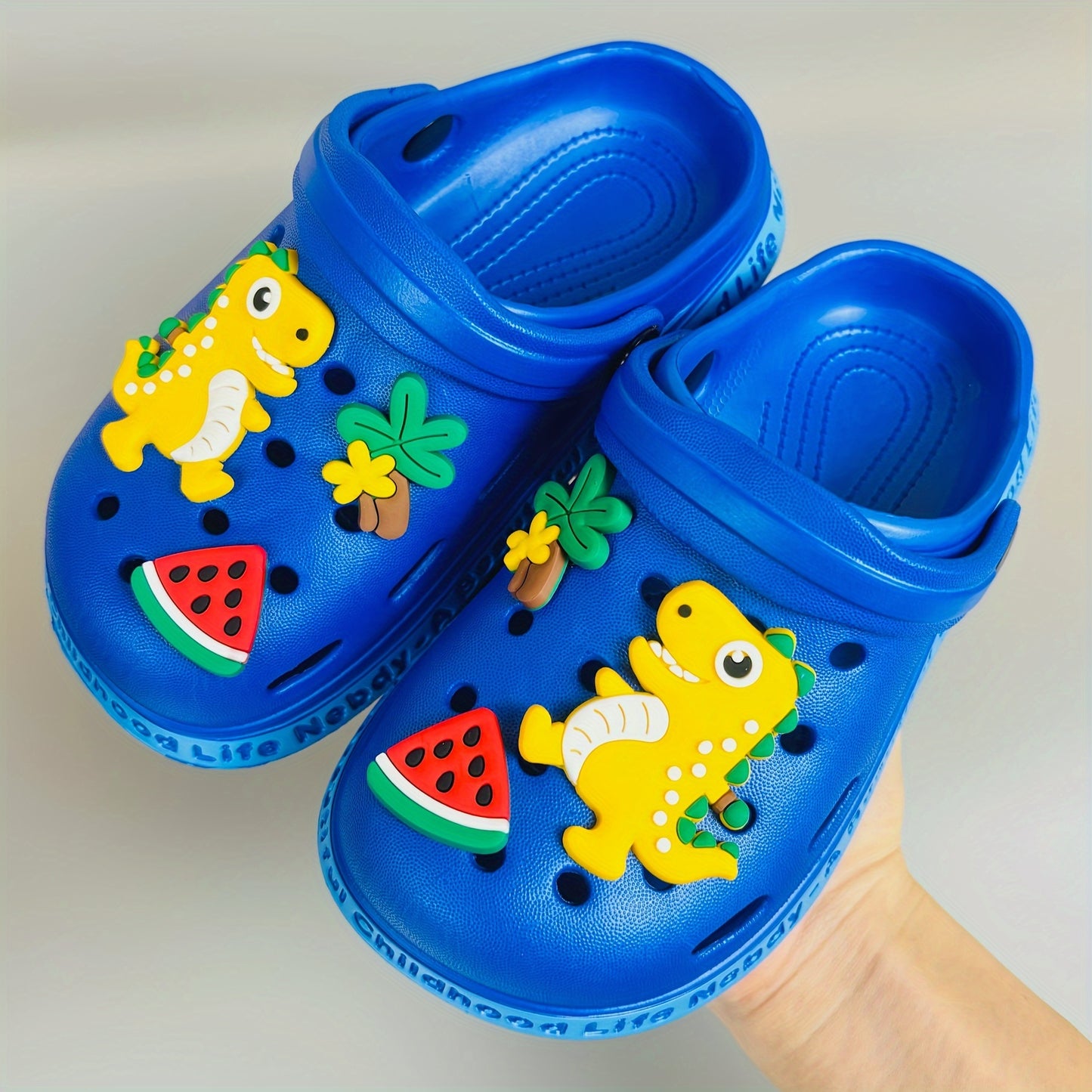 Children's adorable dinosaur clog sandals for breathability and quick-drying, ideal for beach, water activities, and casual wear.