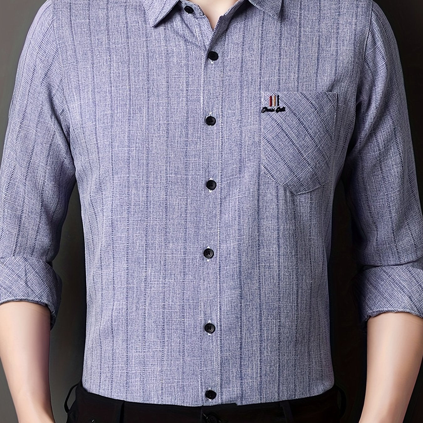 Men's striped shirt with chest pocket, collar, and long sleeves.