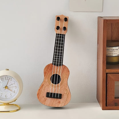 Mini playable uke instrument figurine made of plastic for home and office decor, ideal gift for music enthusiasts.