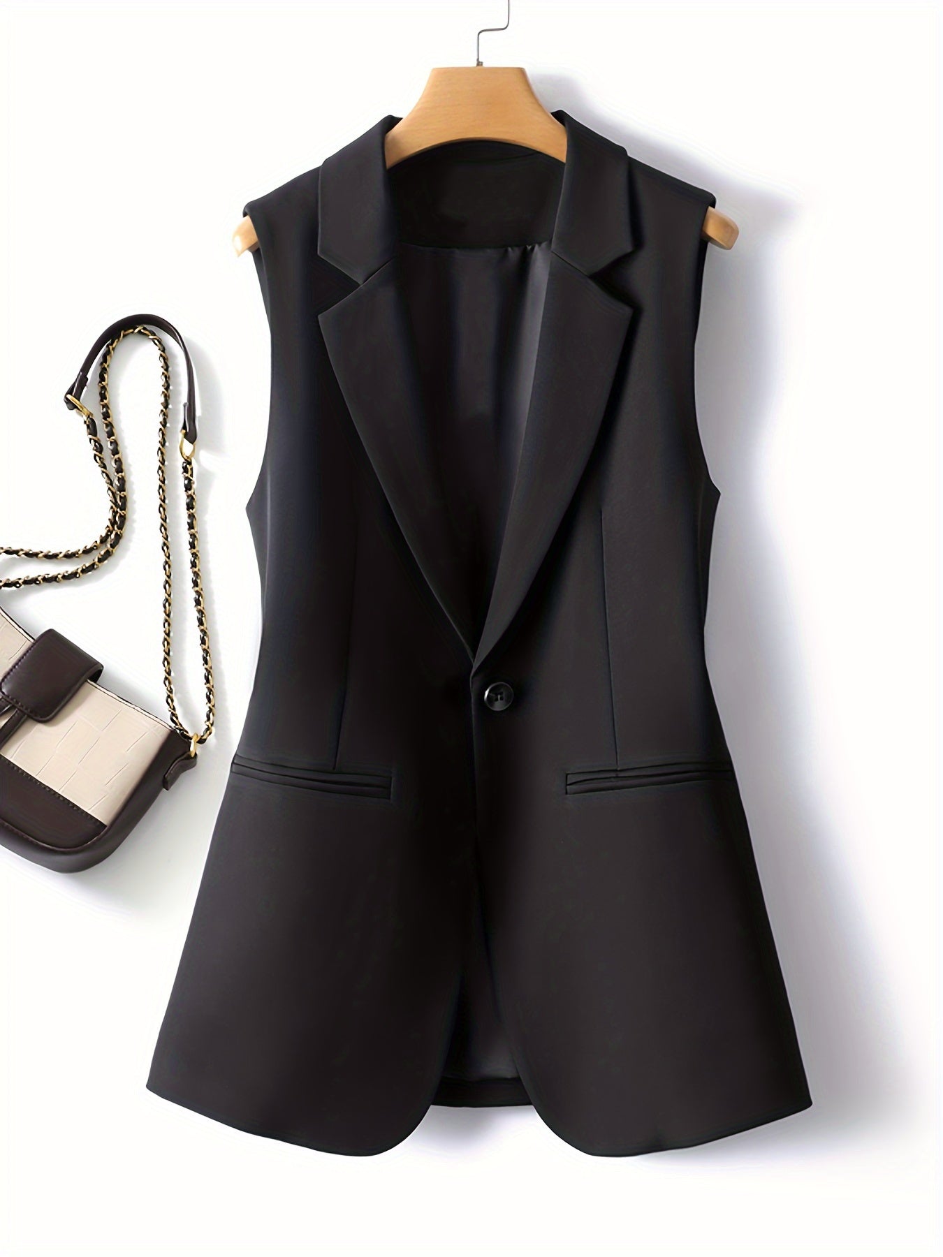 Sleek solid color button-front vest with sleeveless lapel collar for spring & fall.