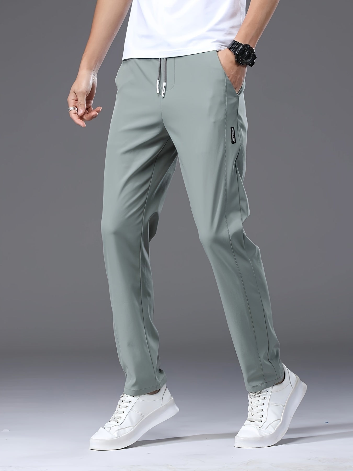 Men's slim fit drawstring sports pants, lightweight quick-dry trousers for summer leisure wear.