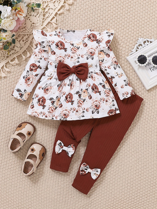 Floral print flutter sleeve top and bow-accented elastic waist pants set for girls. Comfortable knit outfit, machine washable. Made from polyester-spandex blend. Ideal for spring/fall