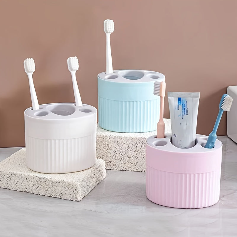 Toothbrush and toothpaste storage rack with detachable shelf for bathroom organization, easy to clean and convenient for makeup brush storage.