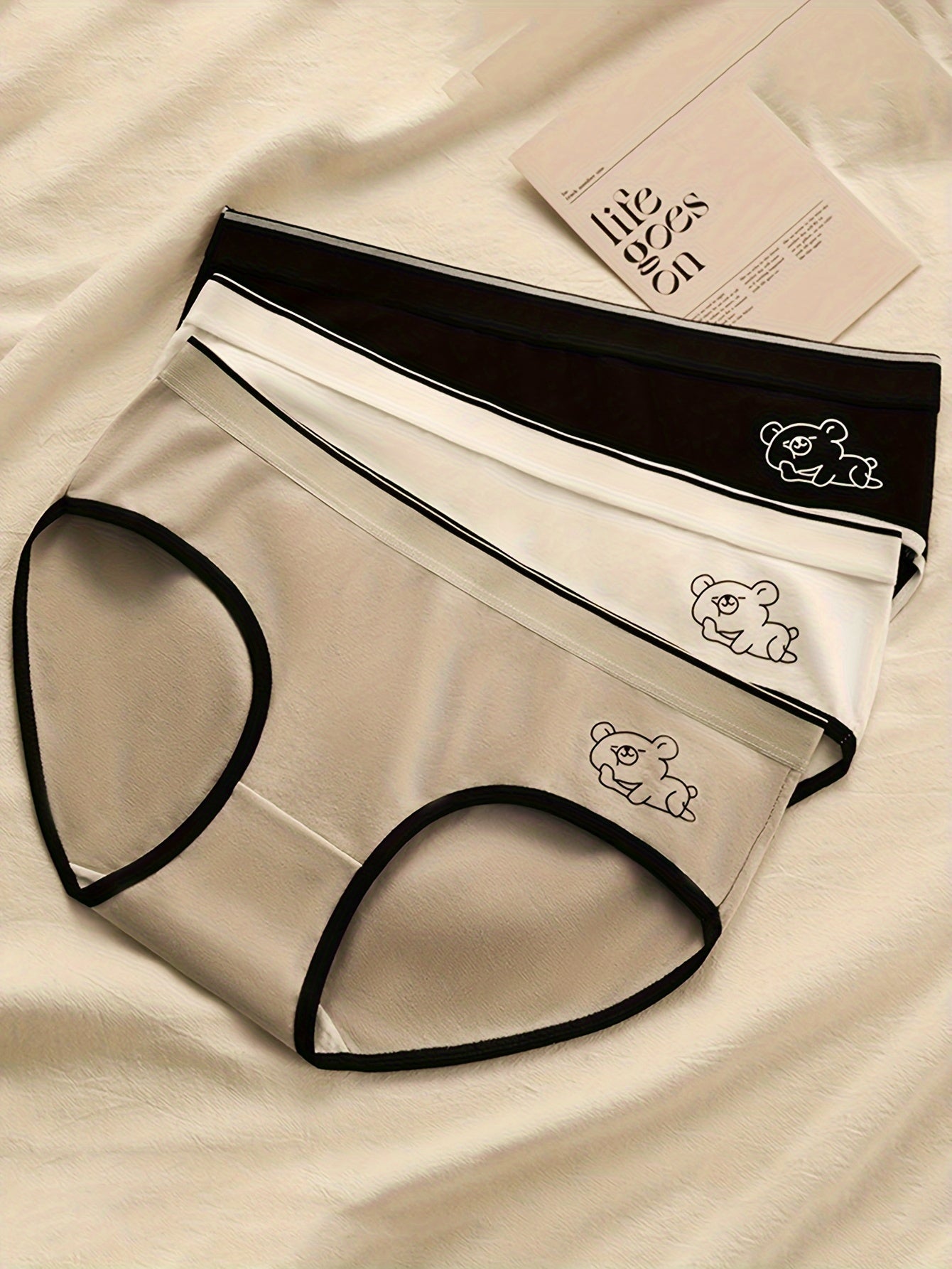 Women's 3-pack of cute cartoon bear briefs in a soft, breathable polyester blend.