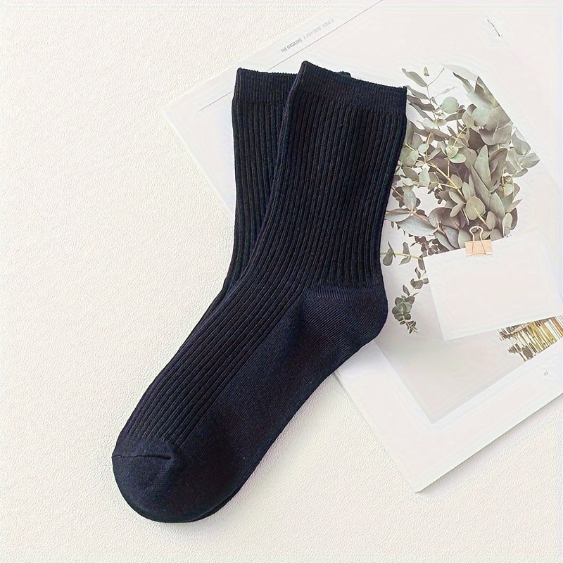 Men's solid color socks in a multi-pack of 2 or 5 pairs, breathable mid-calf sports socks suitable for all seasons. Trendy and boneless design.