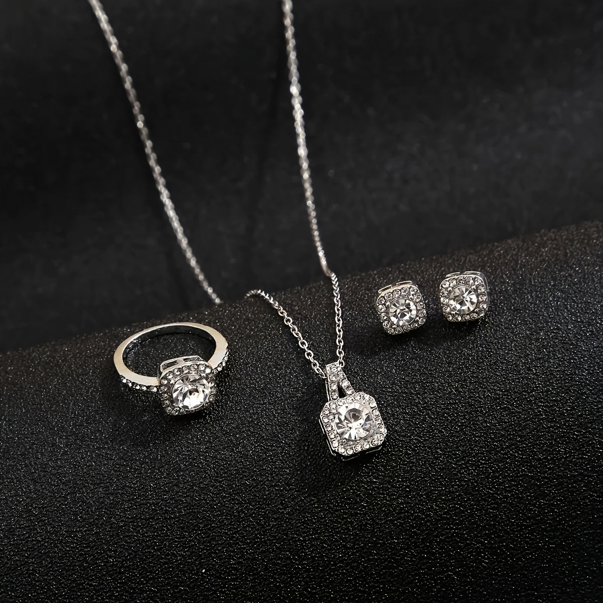 Set includes earrings, ring, and necklace with square synthetic Zirconia design, perfect for special occasions and gift giving.