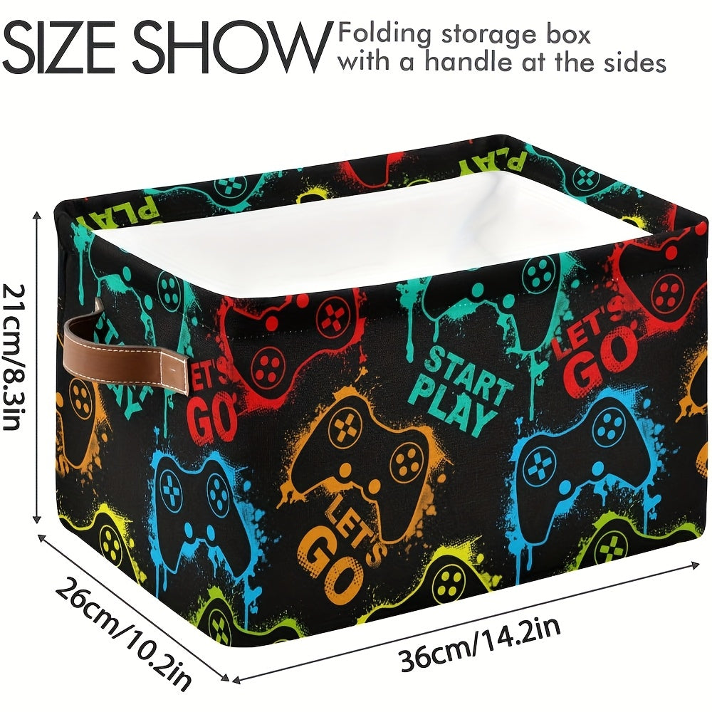 Durable black fabric bin with vibrant controller design. Foldable canvas organizer with handles for clothes, books, toys. Perfect for home, office, or closet organization.