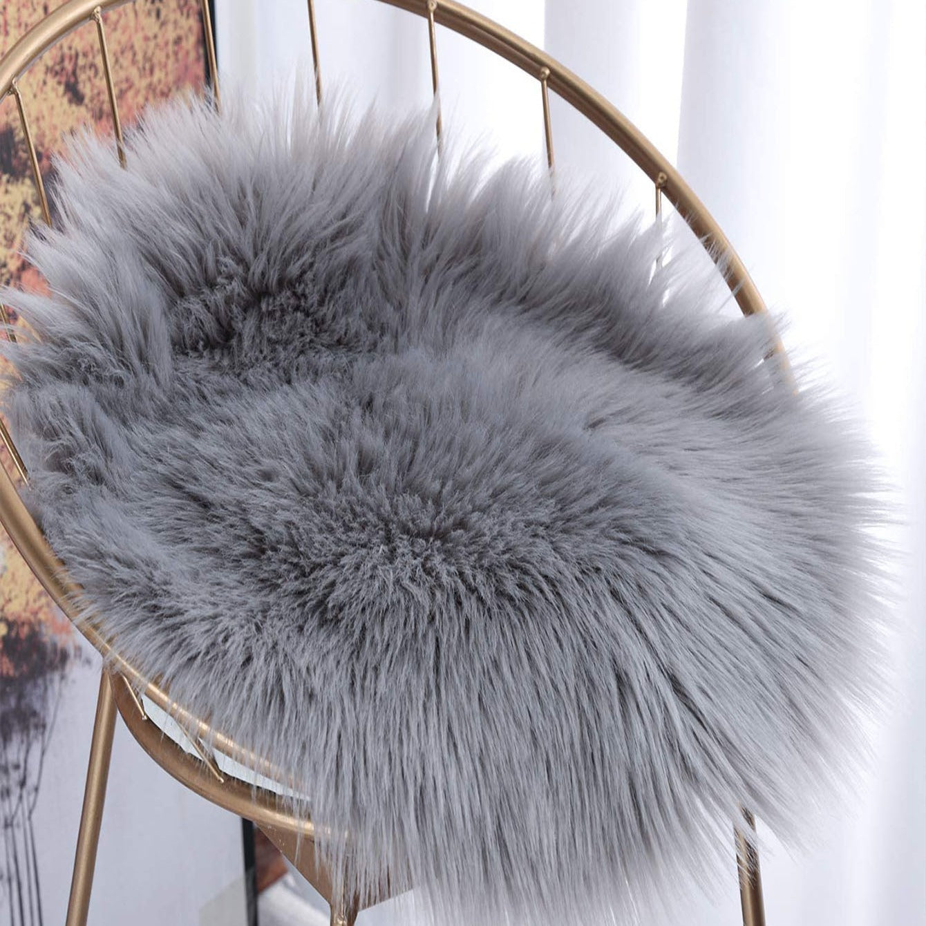 Soft and fluffy grey faux fur area rug and chair pad set. Perfect for adding a cozy touch to your living room. This set includes a small 12-inch round cover for seat cushions and carpet mats.