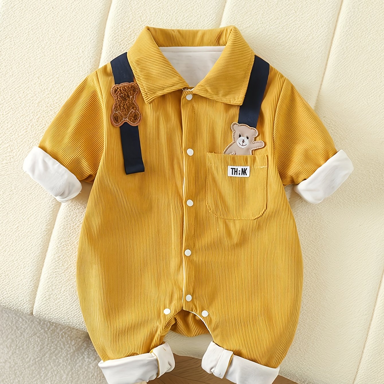 Mustard yellow bear patchwork romper with striped straps for baby boys is made of 100% polyester and has a casual style, perfect for spring/fall and outdoor activities.