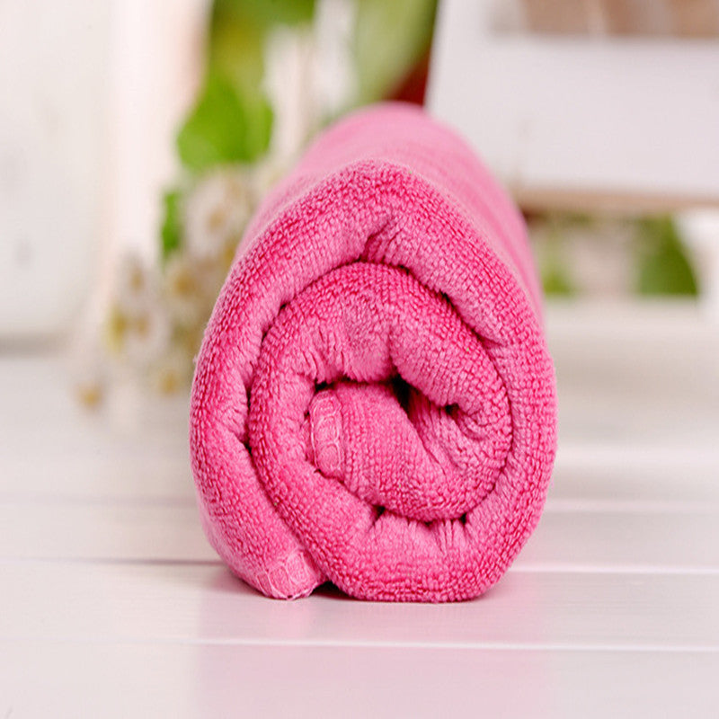 Soft microfiber towel perfect for camping, sports, swimming, and travel - dries quickly and absorbs well.