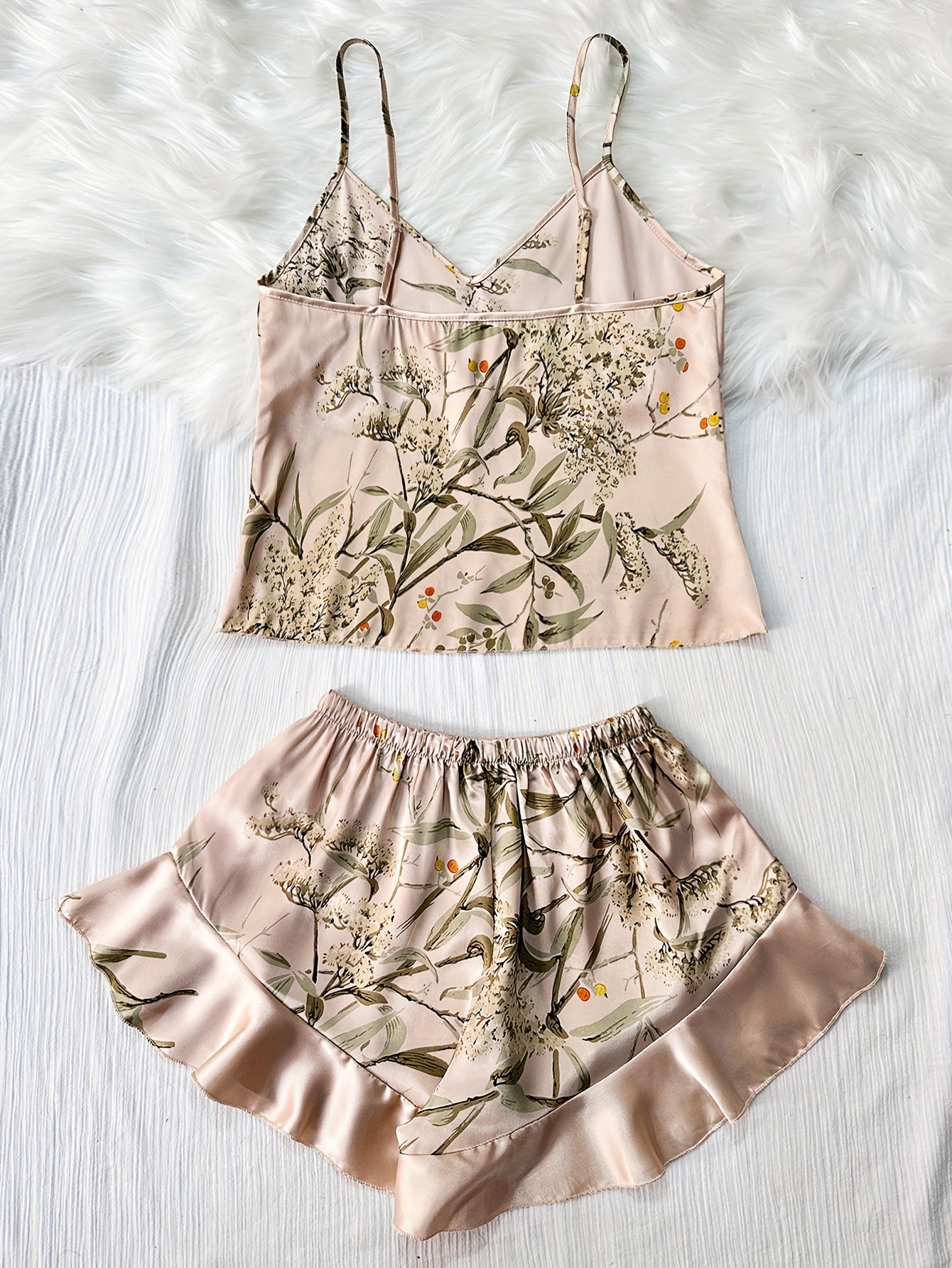 Women's sleepwear set, includes cami top with V-neck and backless design, satin ruffle hem shorts.