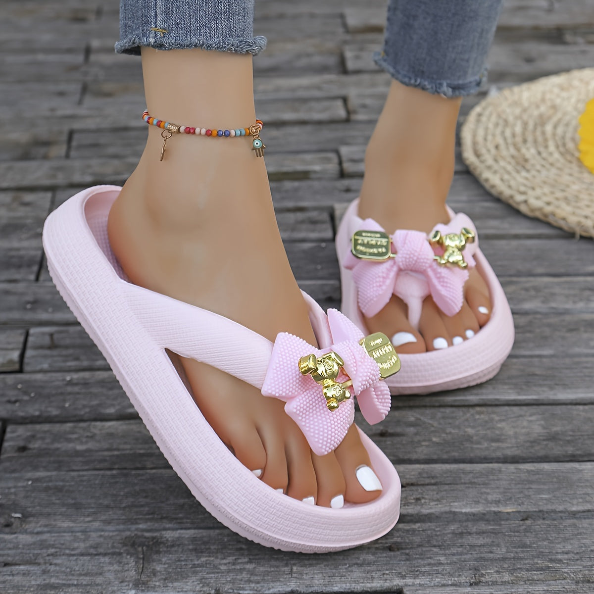 Women's fashionable EVA flip-flops with metallic bow accent, soft and comfortable in pastel colors, easy to clean, perfect for casual and beach wear.