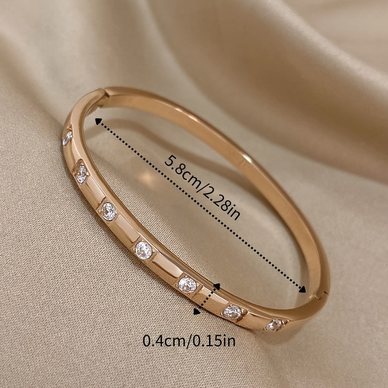 This exquisite rose gold stainless steel bracelet with sparkling rhinestones makes a stunning and opulent gift for your family, loved ones, and friends.