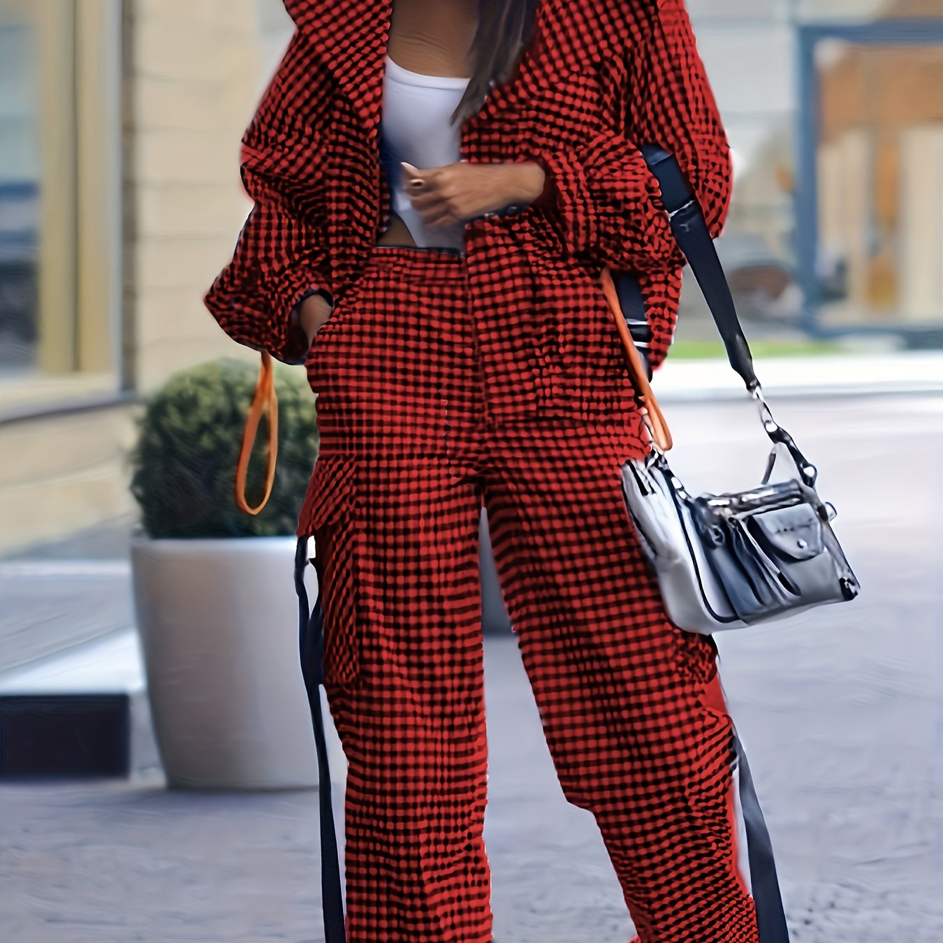 Casual gingham pantsuit for women, with lapel collar and zipper details, made of 100% polyester woven fabric, ideal for fall/winter.