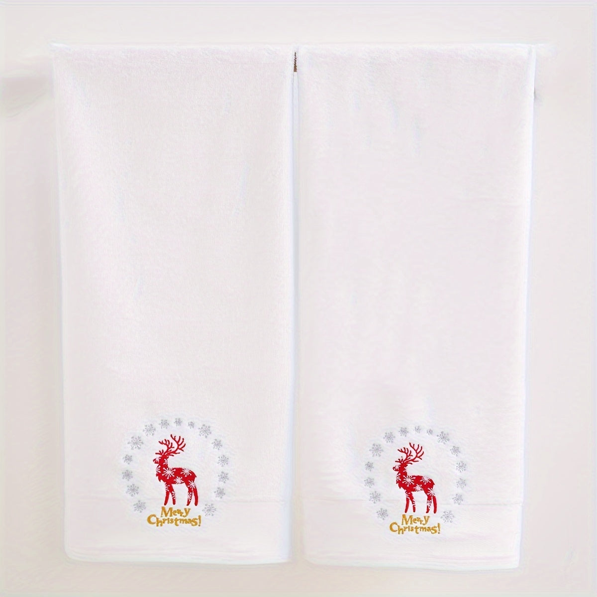 2 QIBHI Vintage Christmas Reindeer embroidered hand towels made from 100% cotton knit fabric. Cartoon-themed oblong bathroom towels perfect for festive holiday gifts. Hand wash only, 450gsm. Adds a playful holiday motif and soft festive texture to your