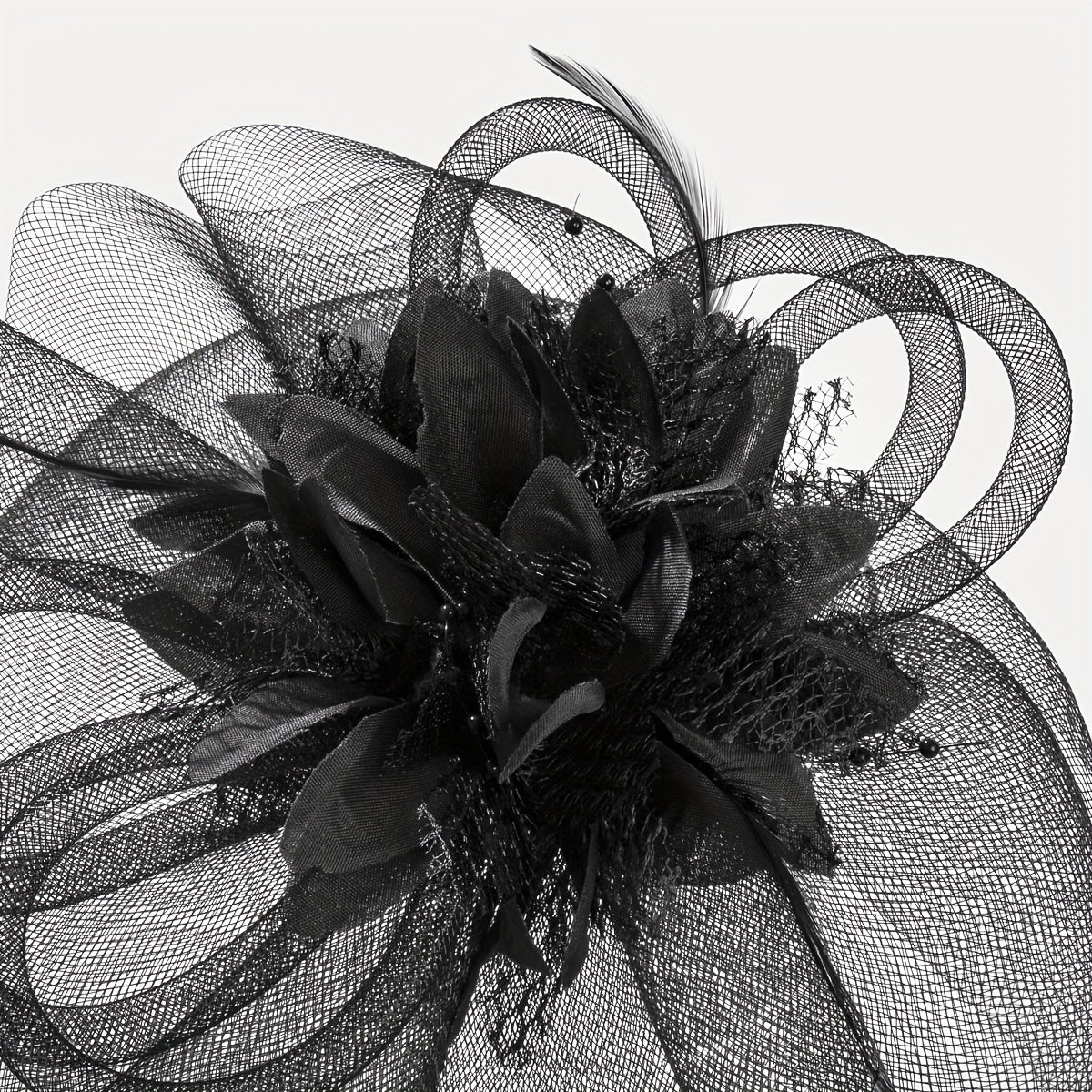 One piece of women's hair accessory featuring a mesh flower, faux feather detailing, and veil perfect for birthday parties, the Jockey Club, weddings, derby hats, and church events.