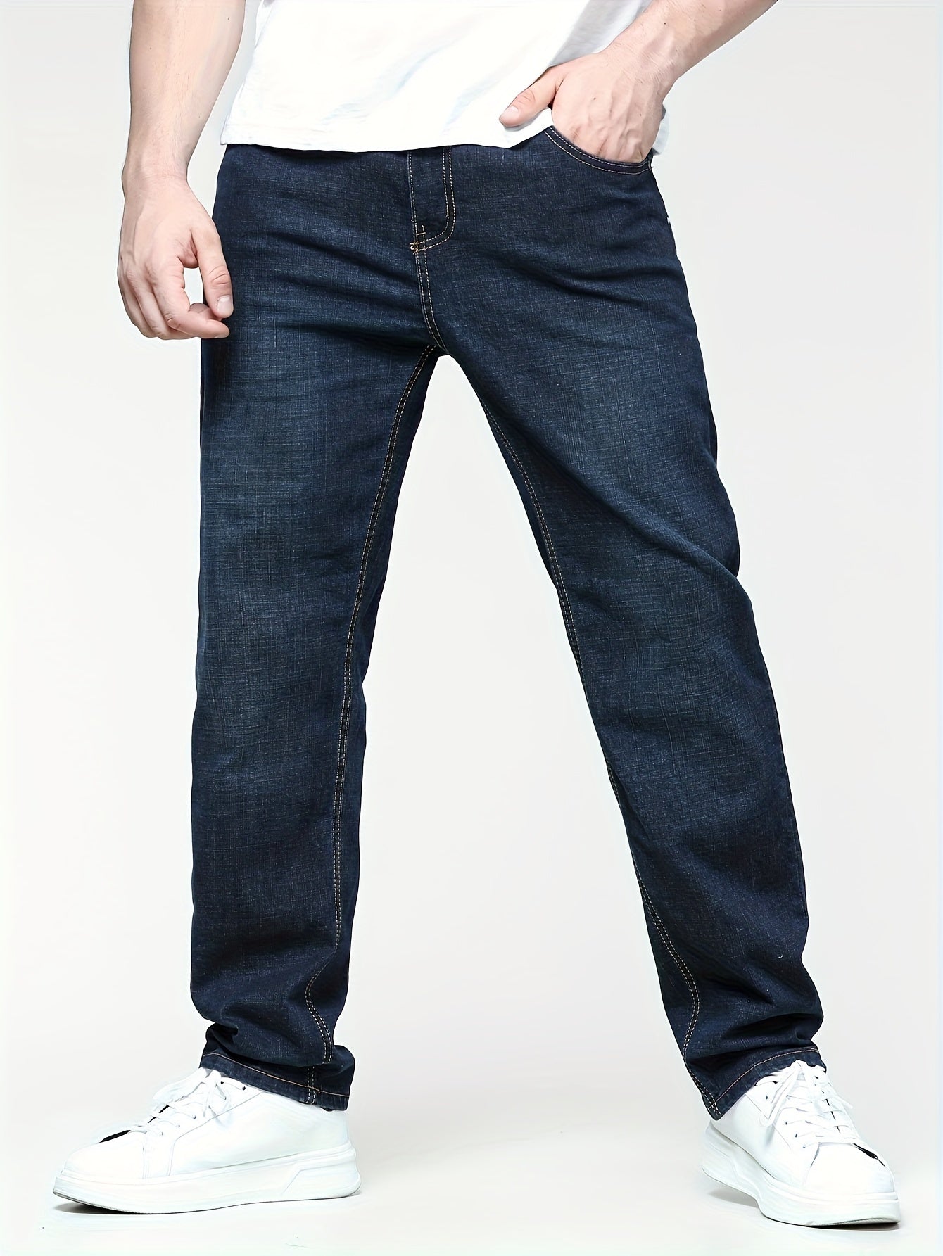 Men's solid denim pants for spring and fall in plus sizes.