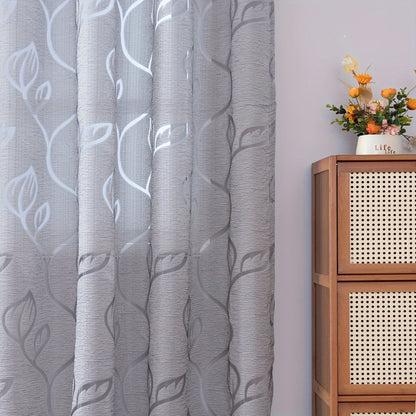 Elegant and contemporary gray floral sheer curtain with a rod pocket design, perfect for enhancing the decor of your living room, bedroom, or home.