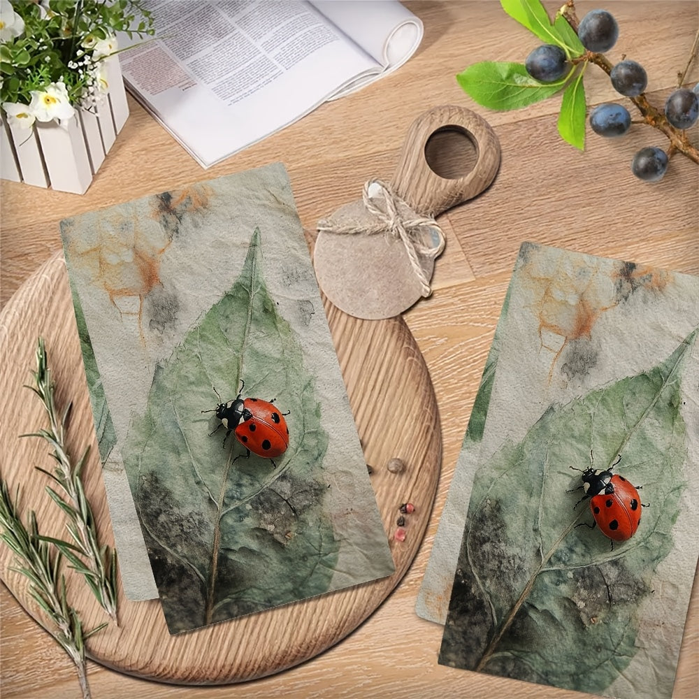 Two Coastal Style Ladybug Kitchen Towels made of highly absorbent polyester knit fabric. These machine washable hand towels are designed in a contemporary oblong shape, perfect for holiday decor. Each towel measures 40.64x60.96 cm and is ideal for drying