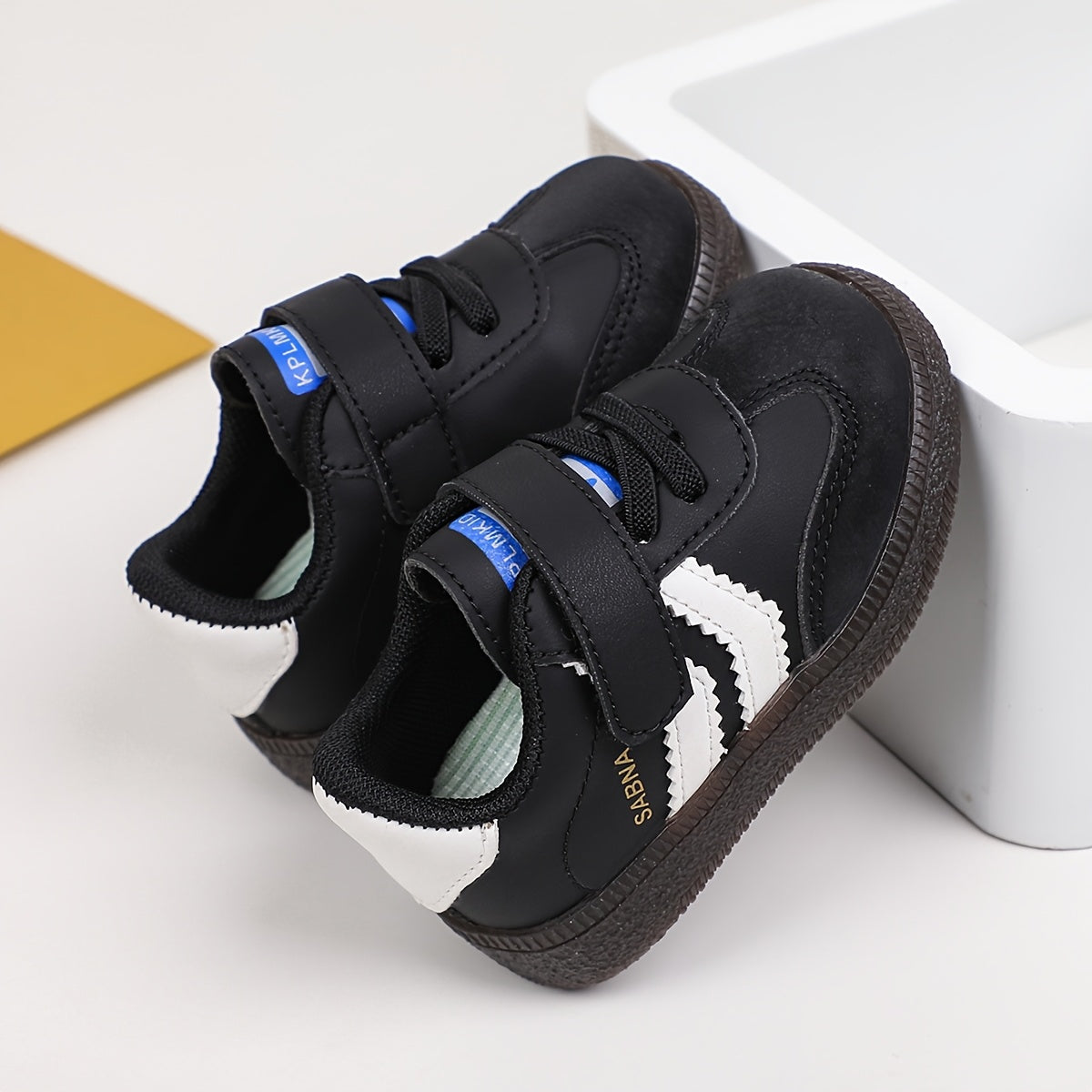 Versatile Boy's and Girl's Casual Sneakers for Spring and Summer. White and black shoes that are comfortable, lightweight, slip-resistant, and stylish for school.