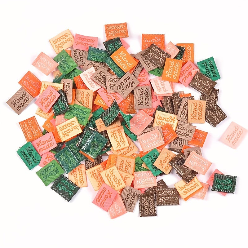 100 handcrafted 1.5cm x 1cm labels with English letters, in multiple colors for sewing onto clothing, accessories, and more as DIY decorations.