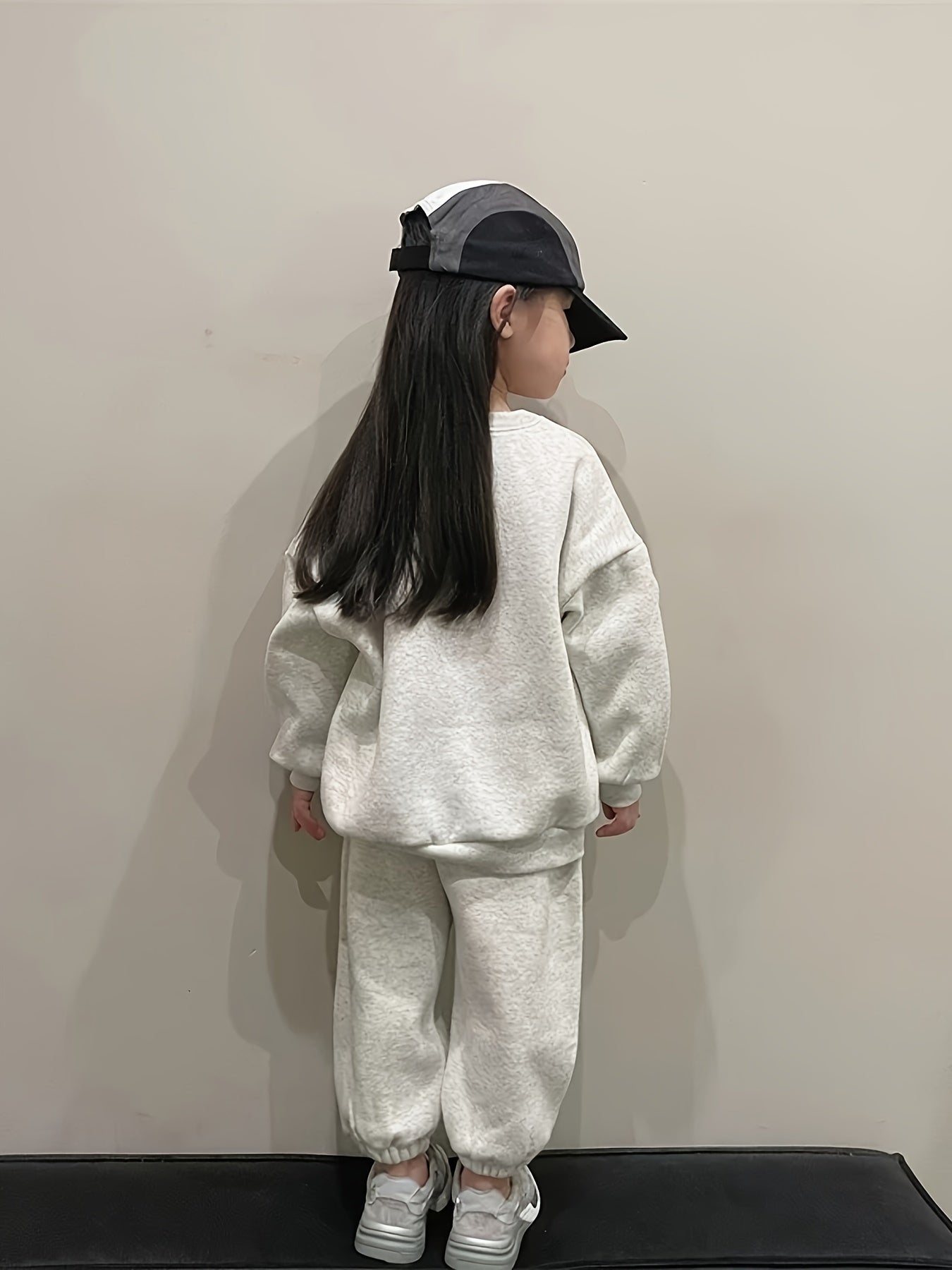 Cotton blend hoodie and jogger set for girls, featuring letter print, long sleeves, crew neck, and pockets. Ideal for spring and fall weather, great for outdoor activities.