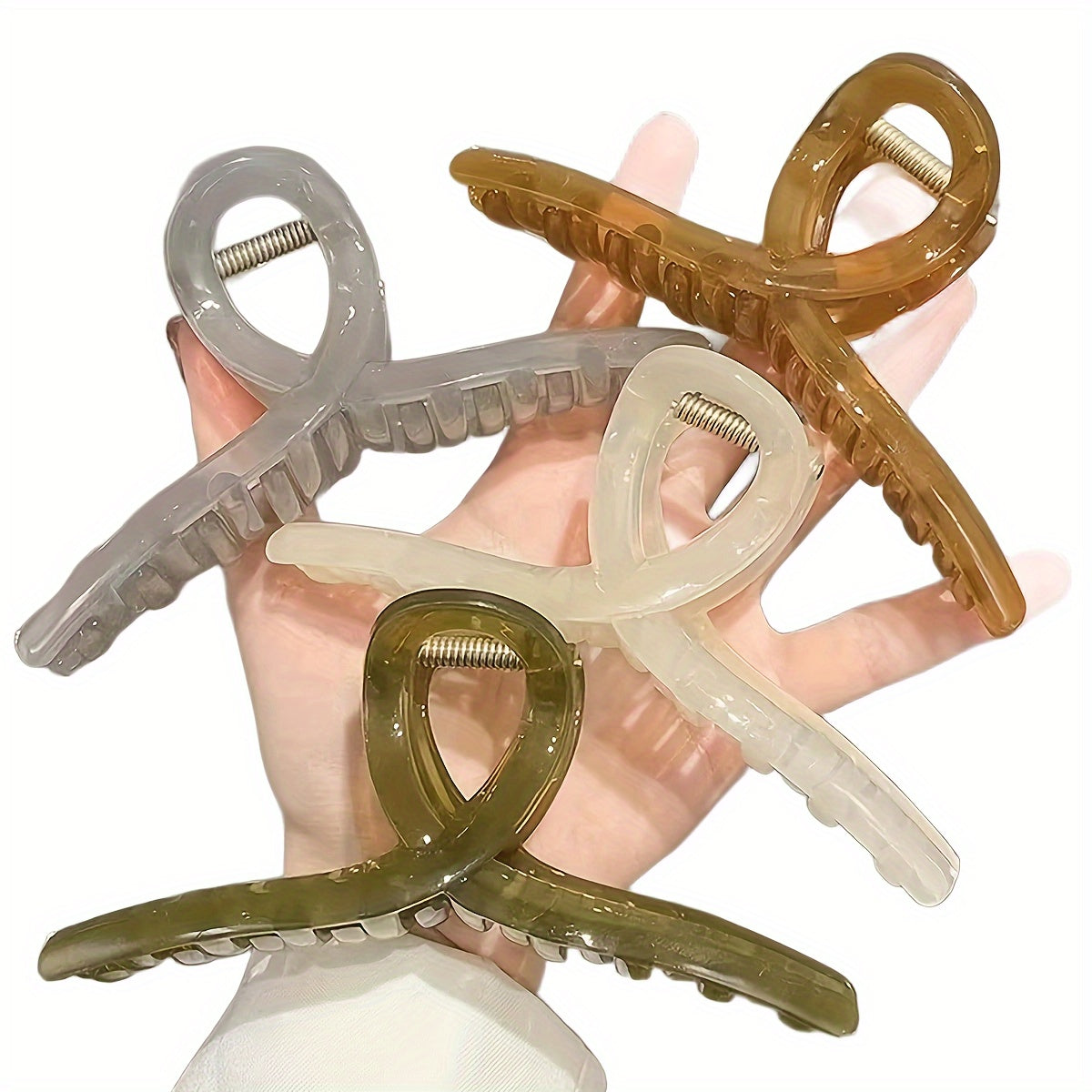 4 transparent grip clips with large shark clip design for back of head hair styling.