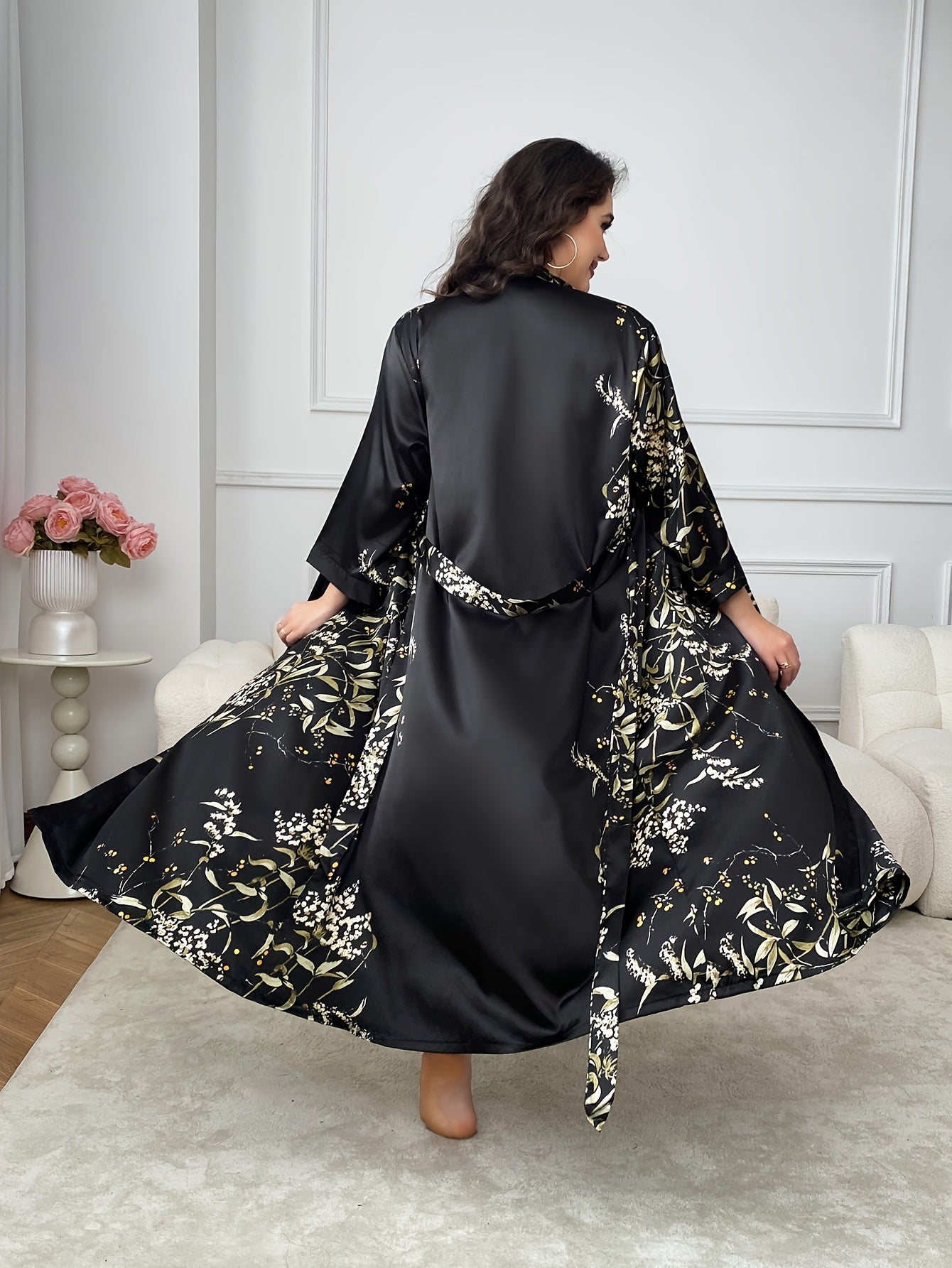 Elegant floral satin kimono robe for plus-size women in black and golden print, with V-neck, long sleeves, belt, and cozy polyester material. Perfect for fall and winter.