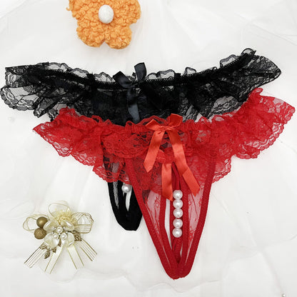 Two pack of solid color charm lace thongs with double bow and massage beaded detail.