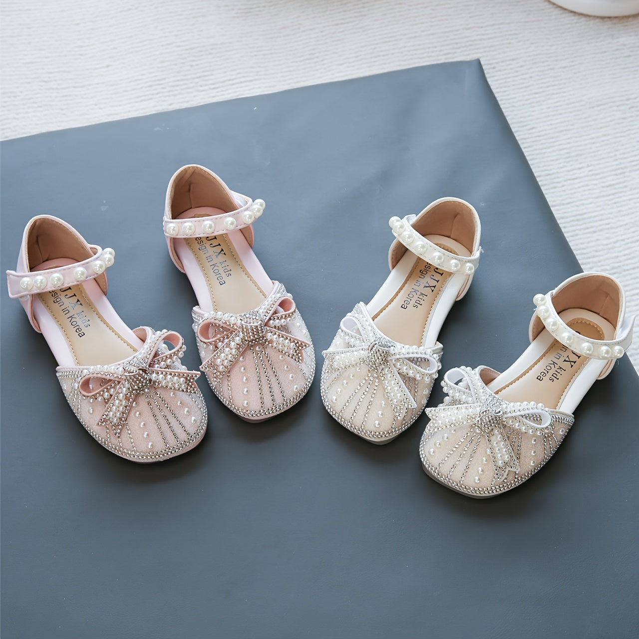 Sparkly bowknot flats with adjustable strap, durable TPR sole, comfortable for daily wear for girls aged 14 and under.