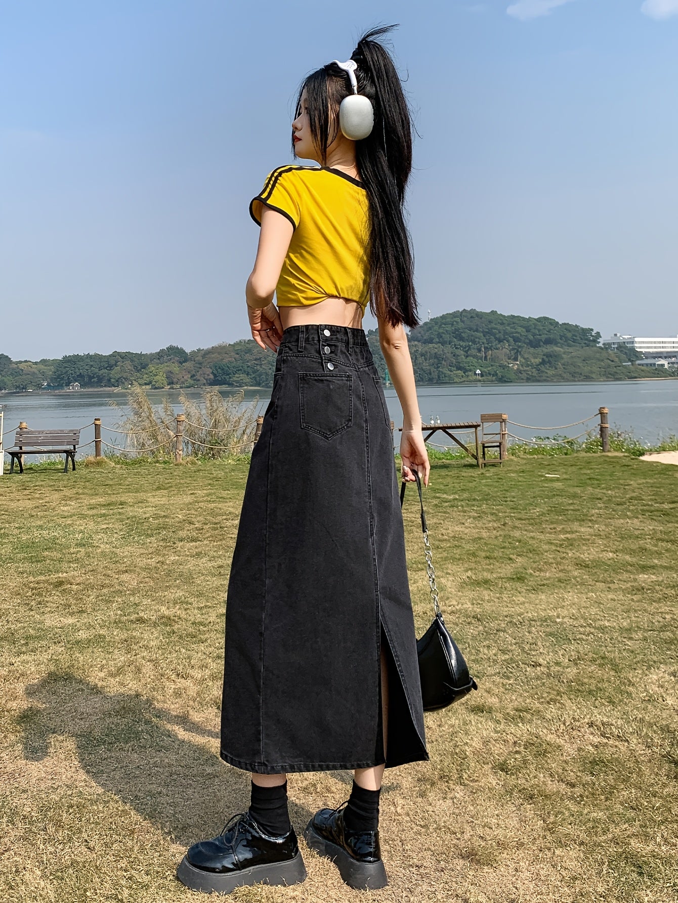 Casual denim midi skirt for women with side slit, mid-rise waist, straight cut, solid color, and pockets. Made of 55% cotton and 45% polyester blend.