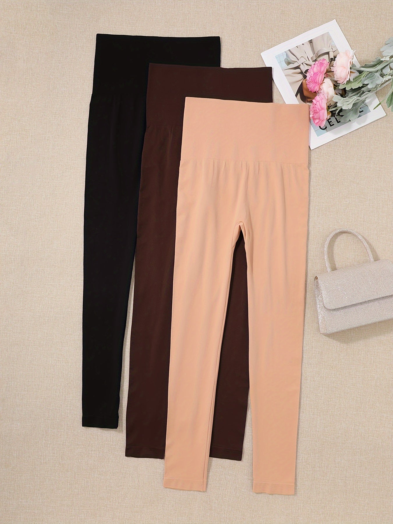 3 high waist shaping leggings for women in black, beige, and brownish-orange. Made of a lightweight, stretchy nylon/elastane blend for a slimming, comfortable fit.