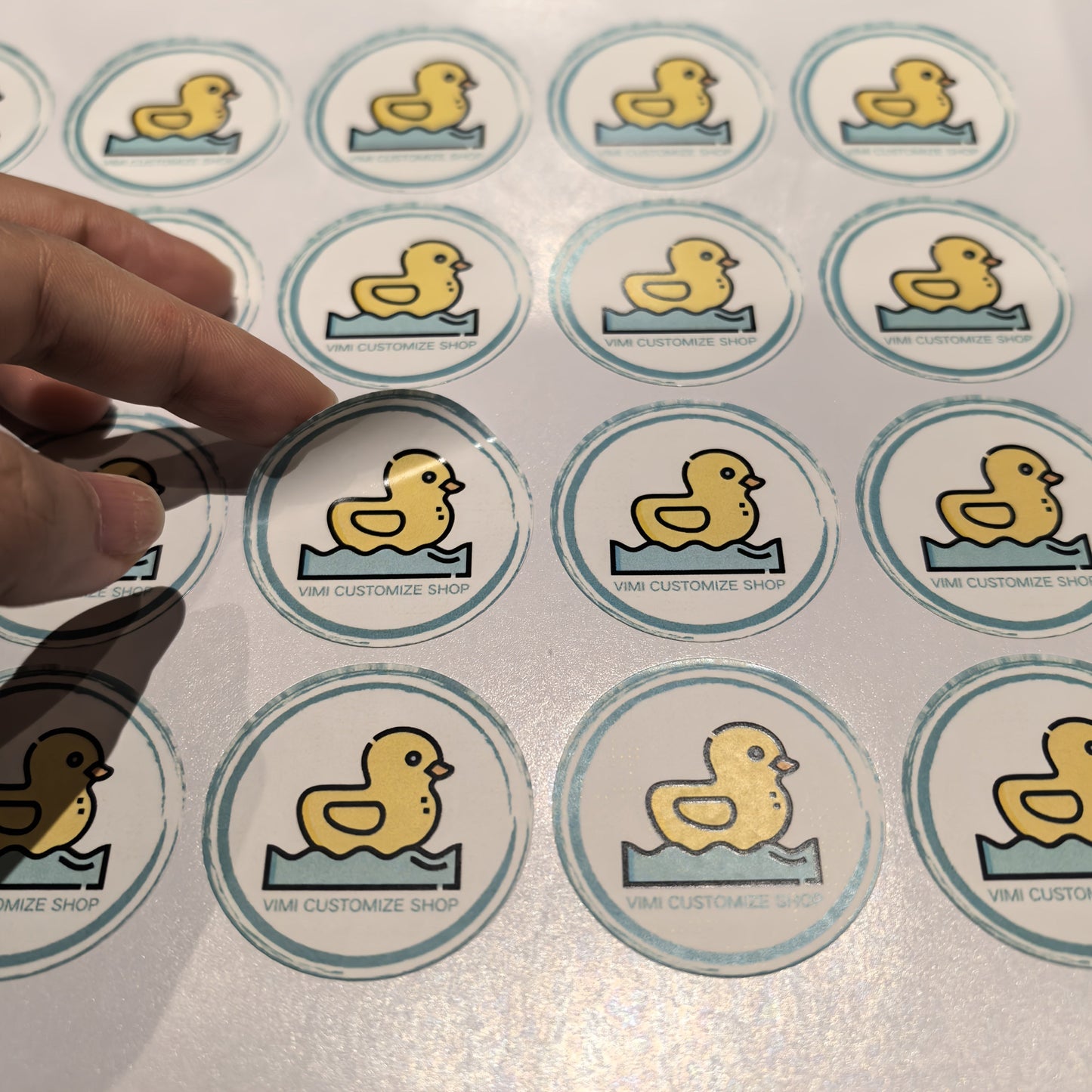 Custom stickers measuring 3.99 cm in size are available in waterproof PVC transparent and white bottom PP paper materials. These stickers can feature your logo, wedding or birthday designs, personalized labels for Christmas and Halloween gifts, or small