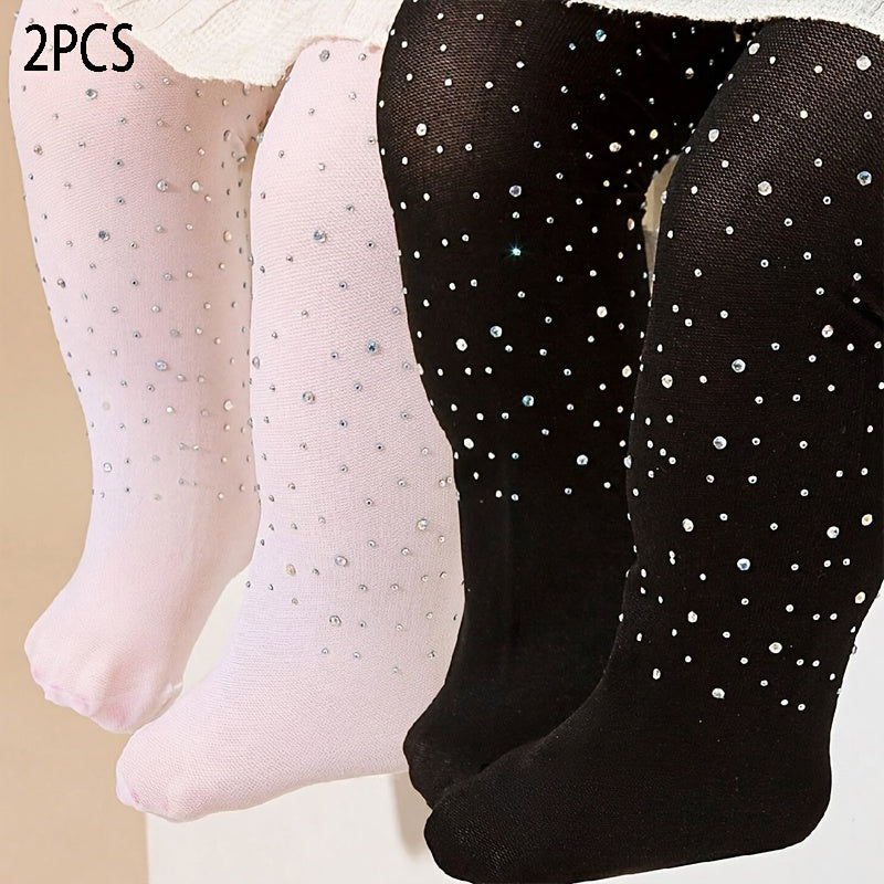 2 pairs of black and white rhinestone-studded tights for baby girls.