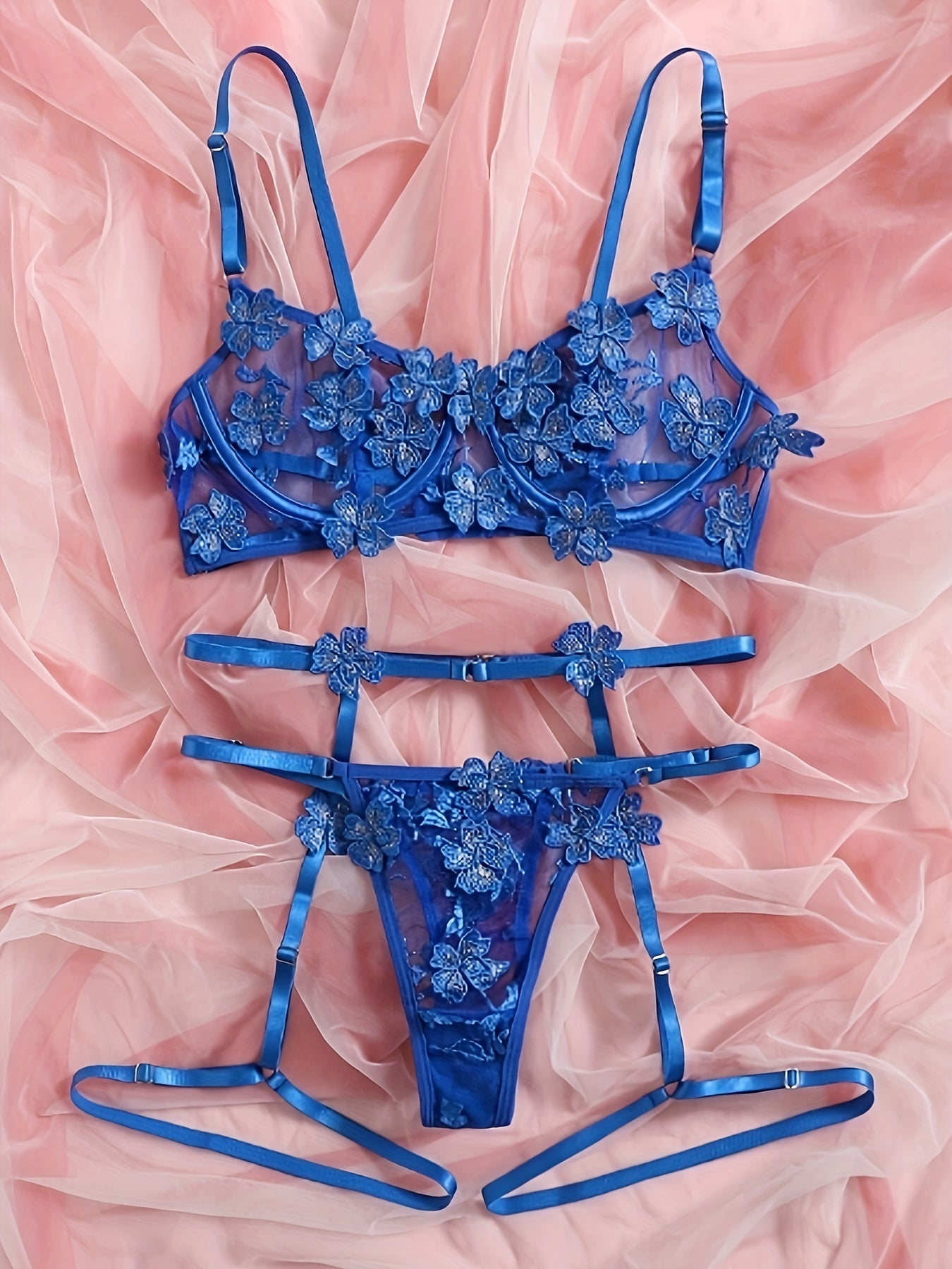 Floral embroidered mesh lingerie set with underwire, hollow-out bra, thong, and garter belts. Sexy and semi-sheer for women.