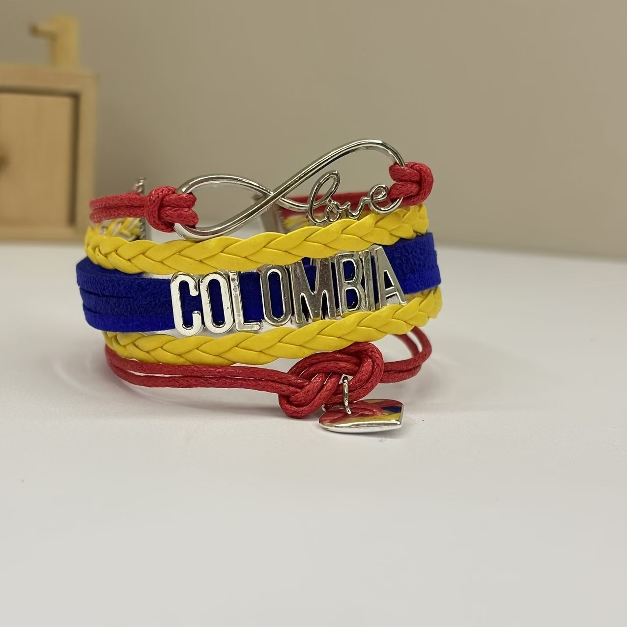 Elegant and passionate Colombia Love Weaving Bracelet made of Colombia alloy with a beautiful love logo design.