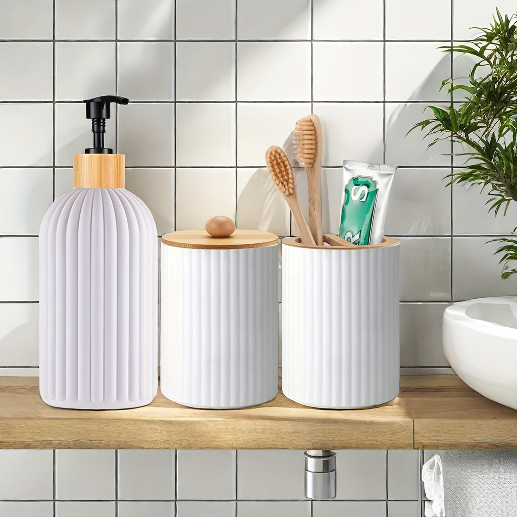 Set of 3 refillable bathroom dispensers made of lead-free plastic. Includes manual pump lotion dispenser, swab holder, and toothbrush organizer. Freestanding design requires no electricity.