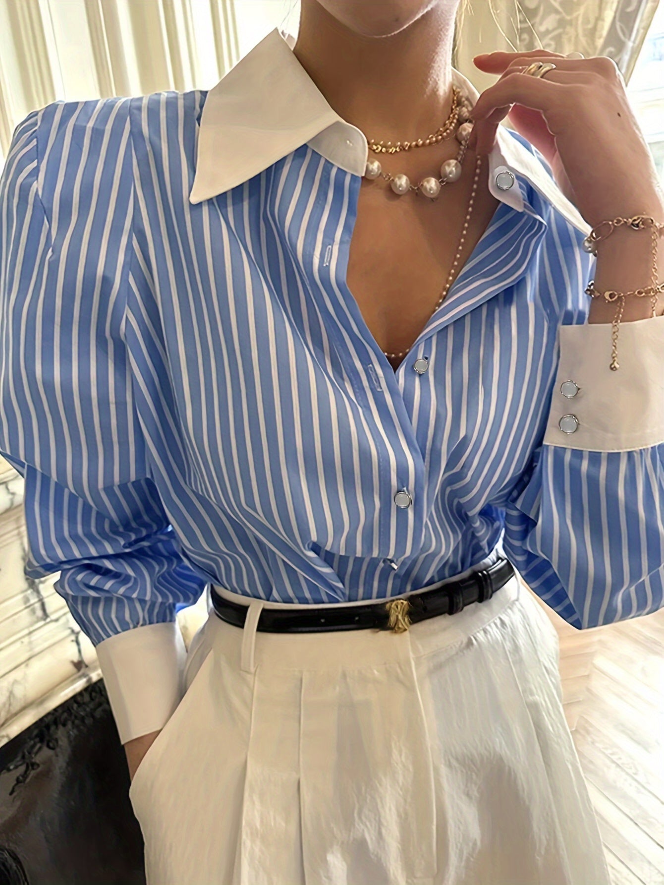 Elegant blue and white striped button-up shirt with neat collar, long sleeve, made of polyester, machine washable. Perfect for office and casual wear, ideal for New Year's celebrations.