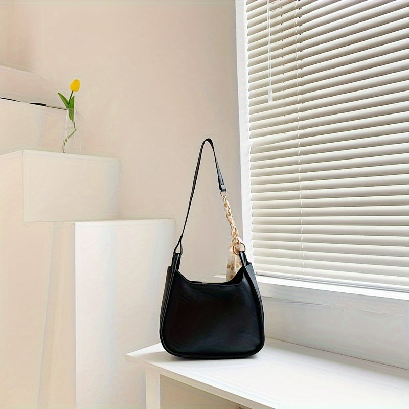 Chic underarm shoulder bag for women made of soft faux leather with a contrast color design.